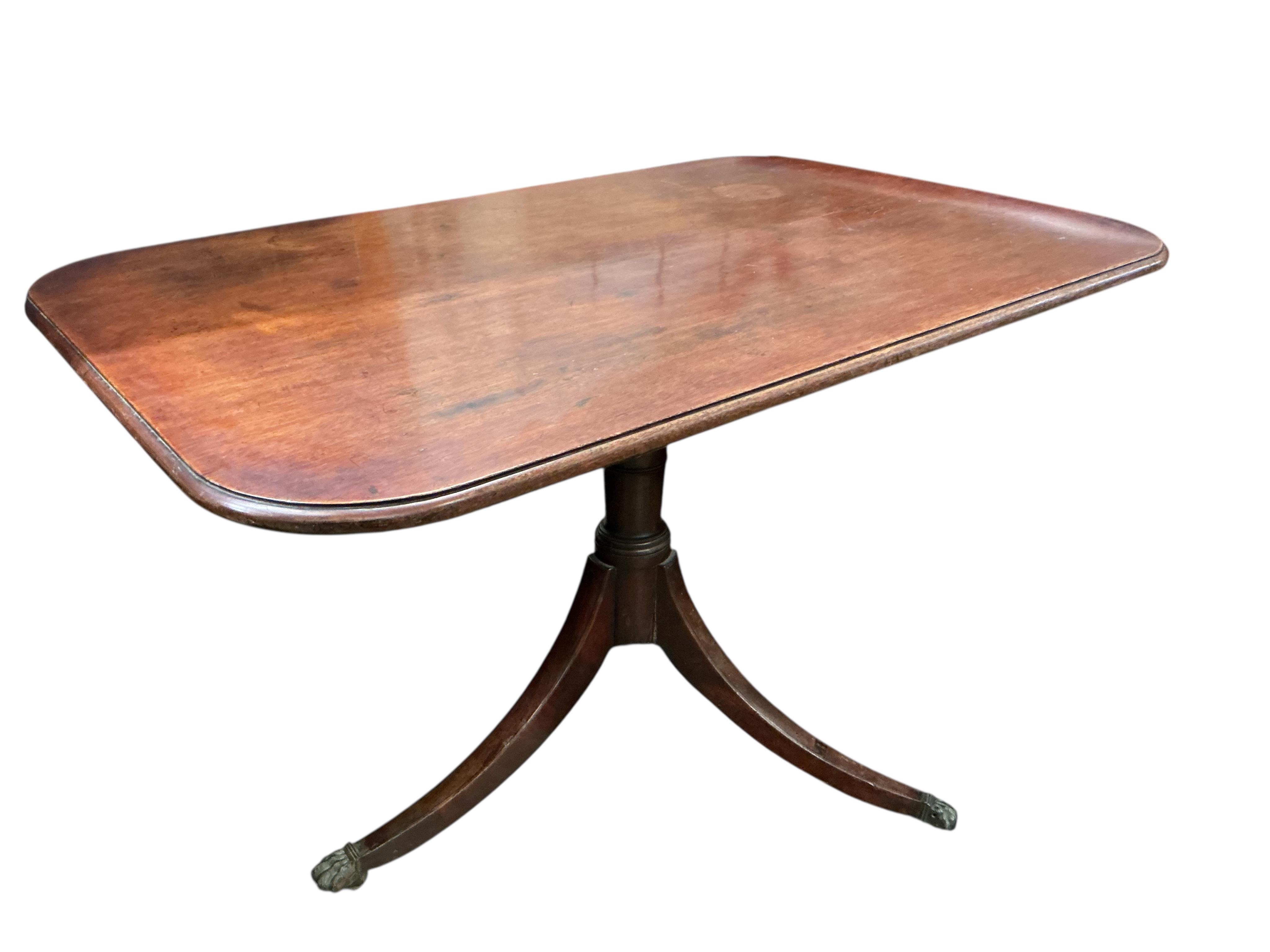 A Regency rectangular mahogany tilt top tripod dining table, width 114cm, depth 76cm, height 72cm